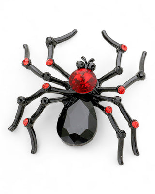 Black spider-shaped brooch with red and black gemstone accents and glossy legs.