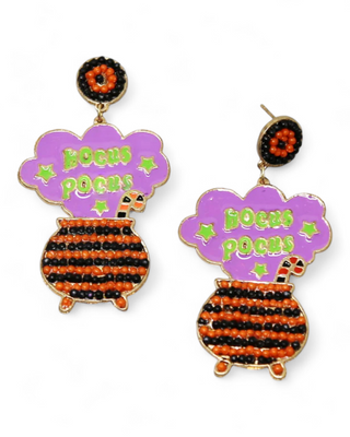 Beaded cauldron earrings with 'Hocus Pocus' text in purple and orange.