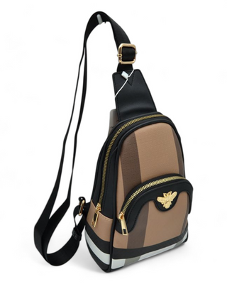 Stylish crossbody bag with gold zipper details and a bee emblem, featuring an adjustable strap and structured design