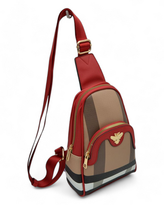 Stylish crossbody bag with gold zipper details and a bee emblem, featuring an adjustable strap and structured design