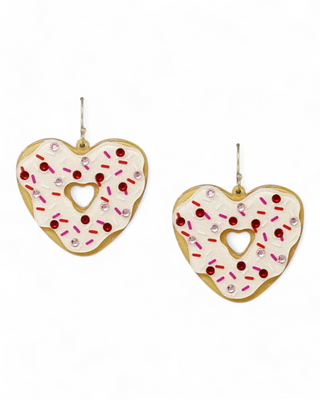 Heart-shaped donut earrings with white frosting, pink and red sprinkles, and a cutout center.