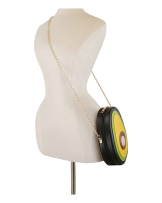 Avocado-themed handbag on a mannequin with a white background