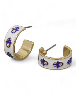 White hoop earrings with blue hamsa hand symbols and gold accents.