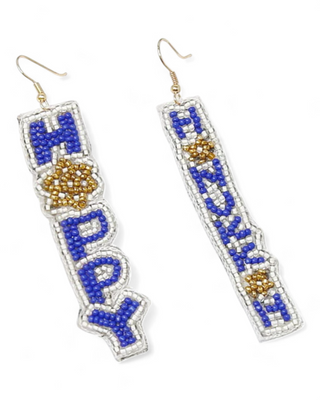 A pair of beaded dangle earrings with the words "Happy" on one and "Hanukkah" on the other. The earrings feature blue, white, and gold beads, with intricate detailing of a Star of David