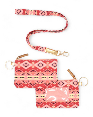 Textile ID holder with a rich tribal pattern in shades of pink and coral, equipped with a gold ring for keys and a clear front pocket for displaying identification cards.