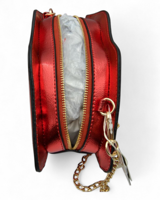Red metallic purse with gold zipper and chain detail on a white background