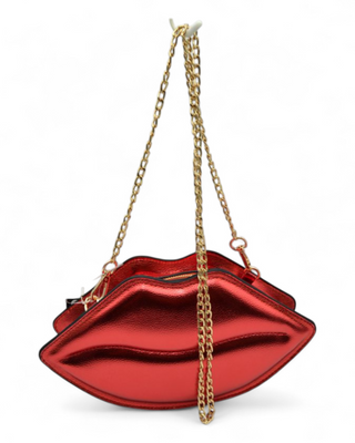 Red lip-shaped handbag with a gold chain on a white background