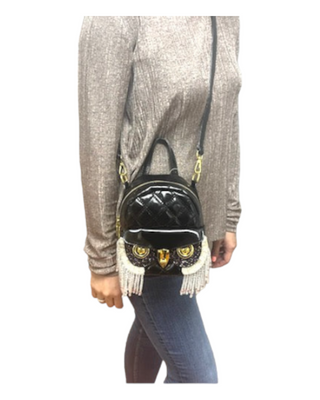 Model wearing black owl shaped crossbody with shiny décor