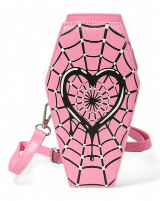 Pink crossbody bag with black heart and web design on a white background