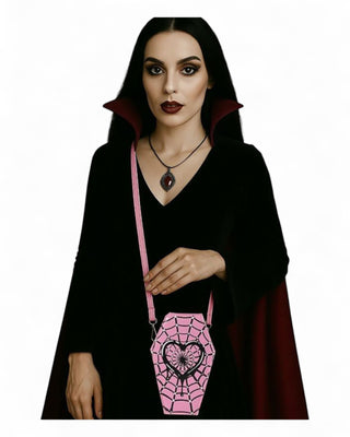 Woman in black costume with pink coffin bag on a white background
