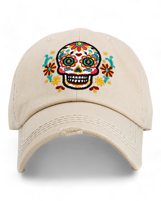 Beige baseball cap featuring a colorful embroidered sugar skull with floral designs.