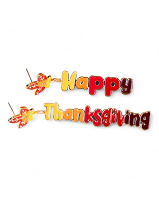 Colorful 'Happy Thanksgiving' statement earrings with autumn leaves accent.
