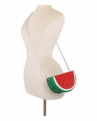 Watermelon-shaped handbag on a mannequin with a white background