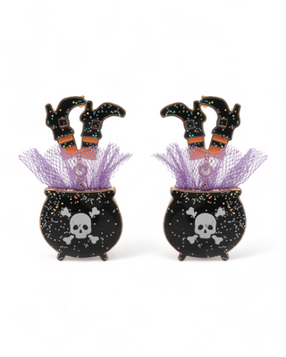 Halloween-themed earrings featuring black cauldrons decorated with skulls and colorful speckles, witch legs in striped stockings with orange and black boots, topped with purple glitter tulle 