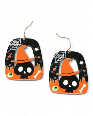 Halloween-themed earrings with a skull wearing an orange witch hat on a black background.