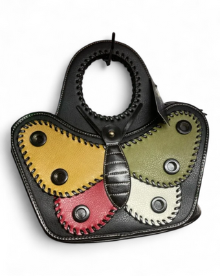 Handbag with colorful gear design on a white background