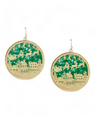 Round earrings with Santa and reindeer cutout scene over a glittery background