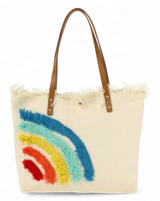 Beige woven tote bag with textured rainbow tufting, frayed top edge, and brown faux leather shoulder straps.