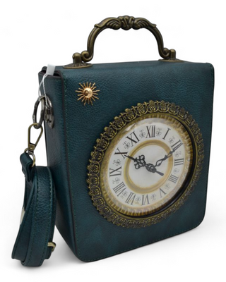 Front view of handbag with ornate handle and vintage-style clock face design.