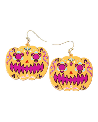 A pair of brightly colored sugar skull earrings, intricately decorated with pink, purple, and yellow patterns, floral motifs, and crosses, ideal for Dia de los Muertos